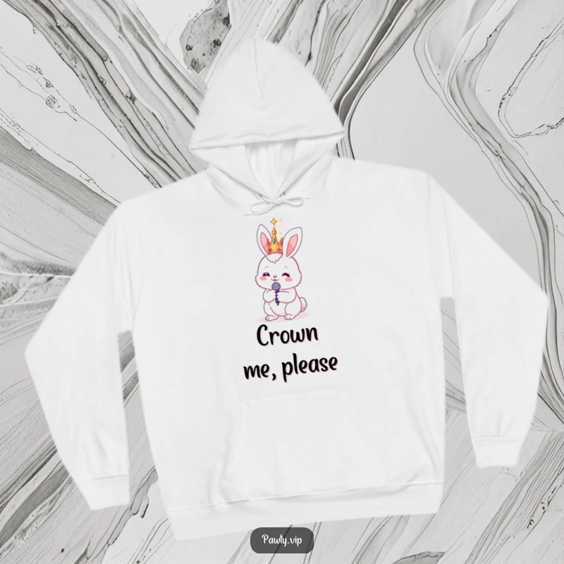 Funny bunny wearing a sparkly crown and holding a microphone, on a warm hoodie, ready to deliver a stellar performance in comfort.