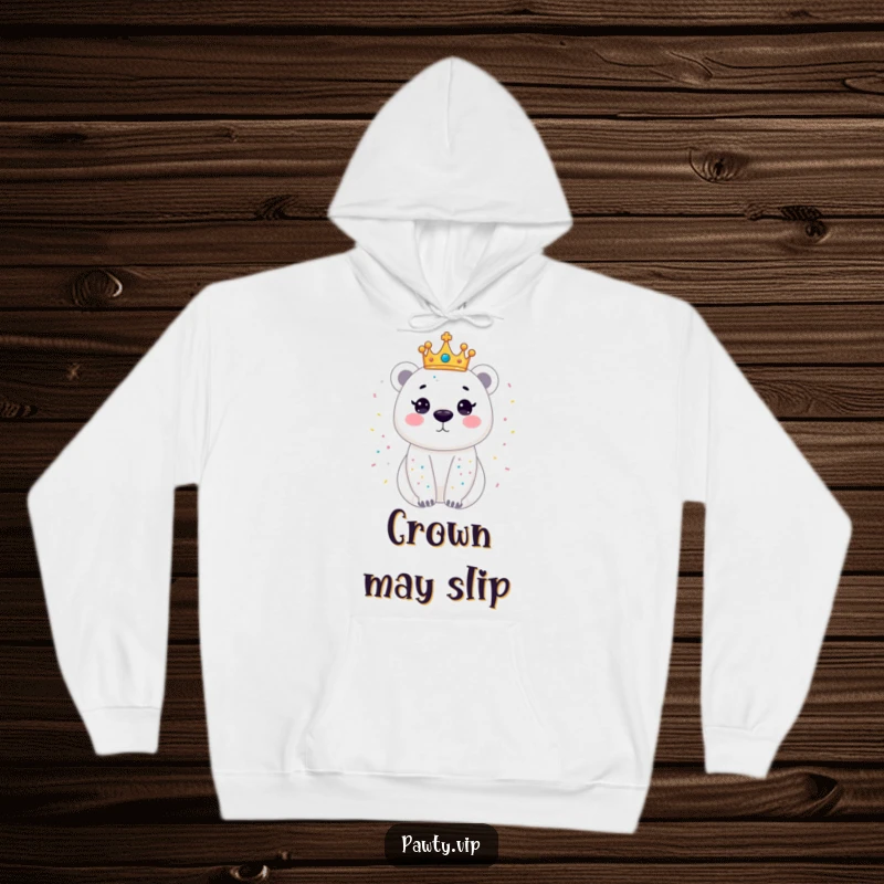 Funny hoodie with a dazzling polar bear wearing a tiny crown, showering in confetti, offering warmth and a touch of regal fun.